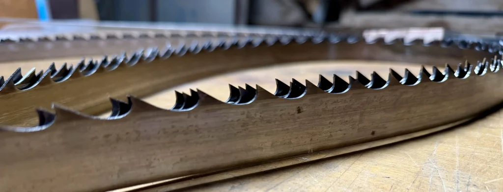 Signs a sawmill blade needs sharpening, including dull teeth can cause slower cuts, blade wanderings and rough lumber.
